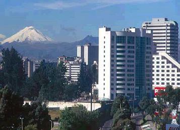 Quito, Ecuador, Cotopaxi volcano & Quito buildings