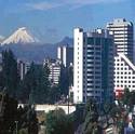 Quito, Ecuador, Cotopaxi volcano & Quito buildings